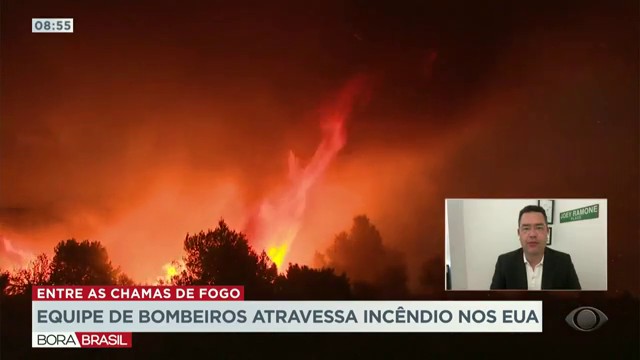 Equipe de bombeiros atravessa incêndio nos Estados Unidos Reprodução TV