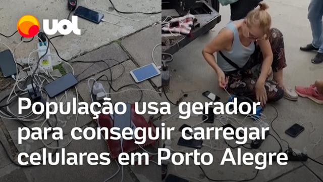 Enchentes no RS: Moradores usam gerador para carregar celulares e dormem em passarela de Porto Alegre